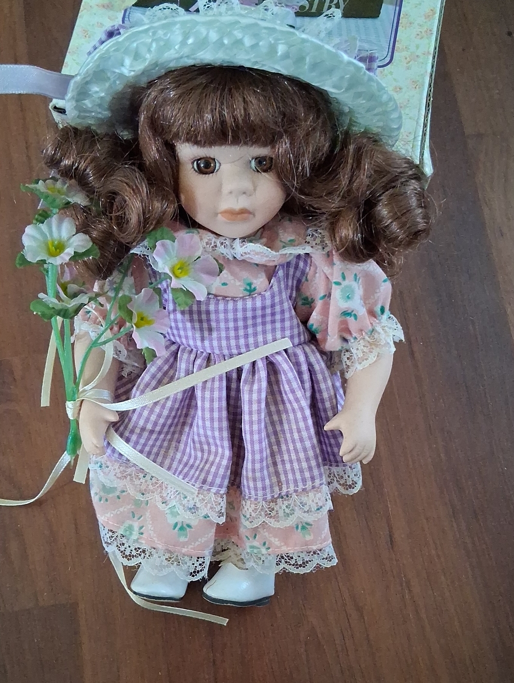 Porcelain Doll in Purple Gingham Dress and Pink Floral Outfit